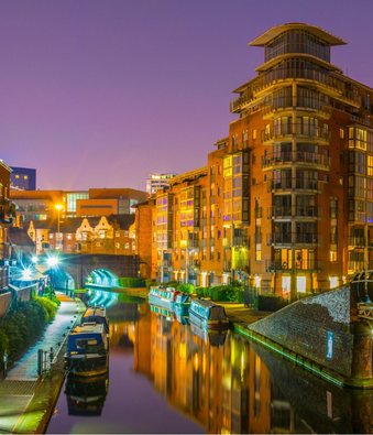 Birmingham city canals and modern waterfront at dusk
