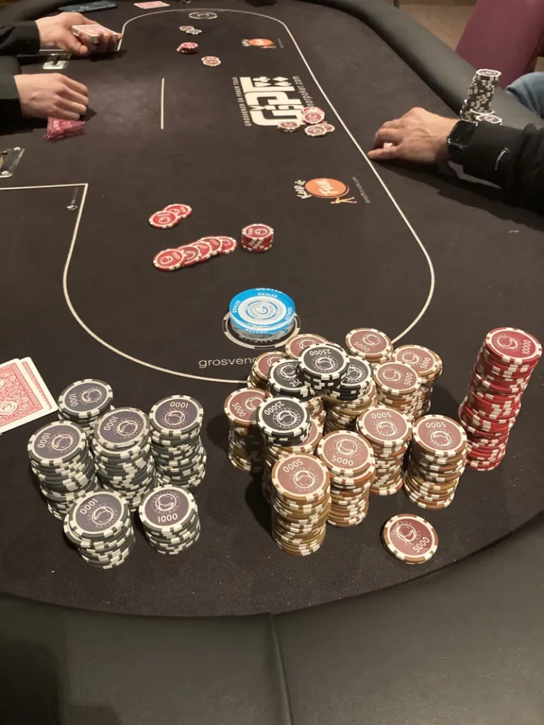 Poker table with chip stacks at Grosvenor Casino Bolton