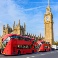 London street view with Big Ben and red double-decker buses