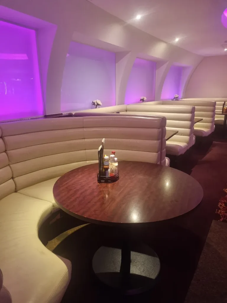 Dining booths with purple lighting at Grosvenor Casino Aberdeen