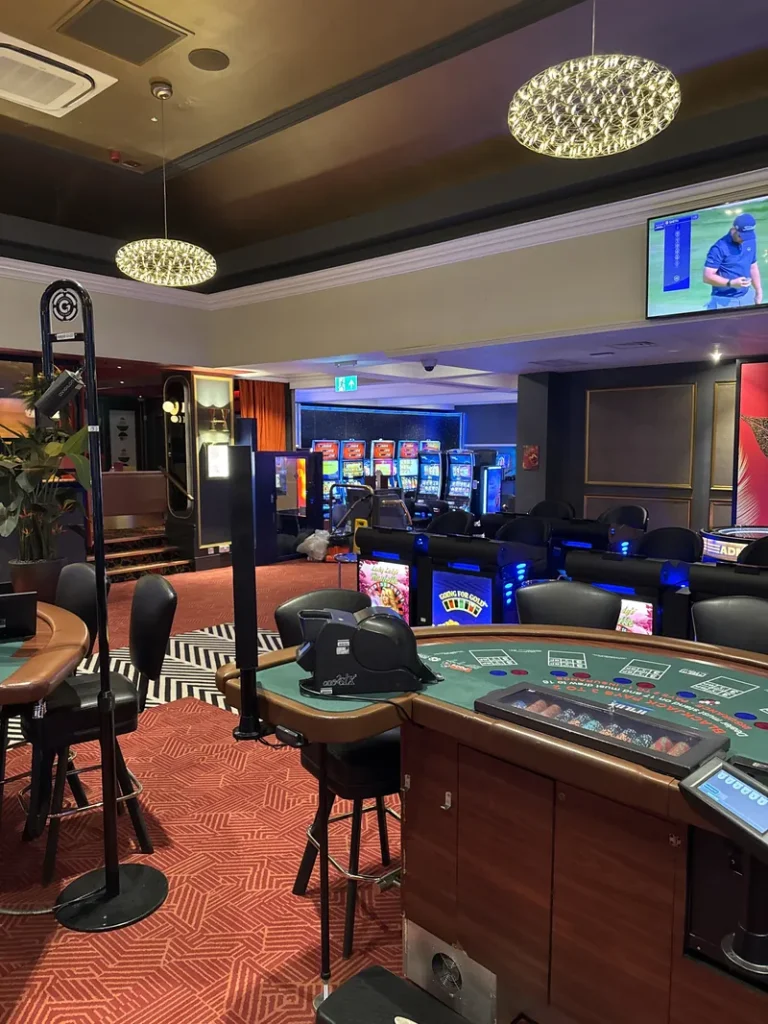 Gaming floor with tables and slot machines at Grosvenor Casino London Bayswater