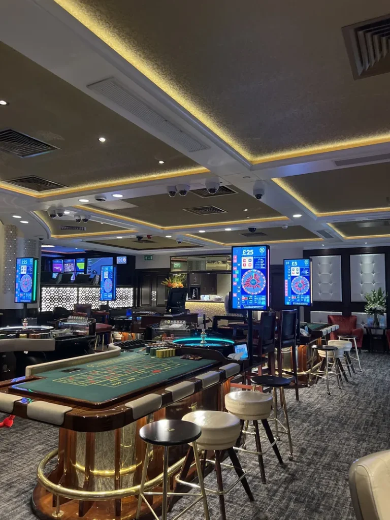 Gaming floor with tables inside Grosvenor Casino London Park Tower