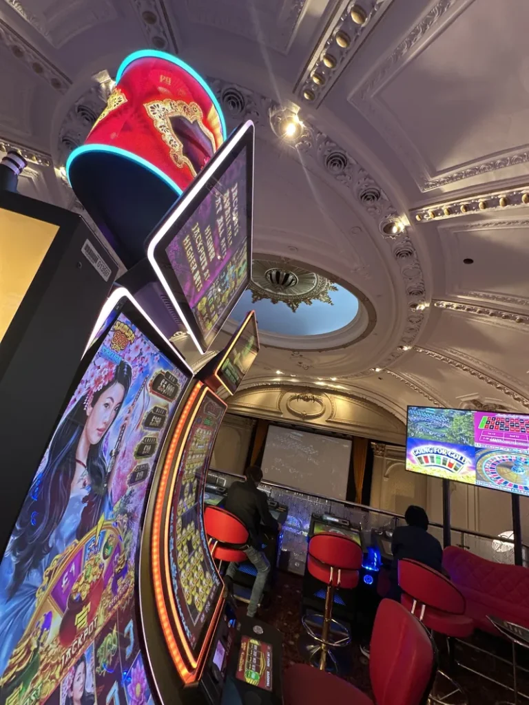 Slot machines under ornate ceiling at Grosvenor Casino London The Rialto