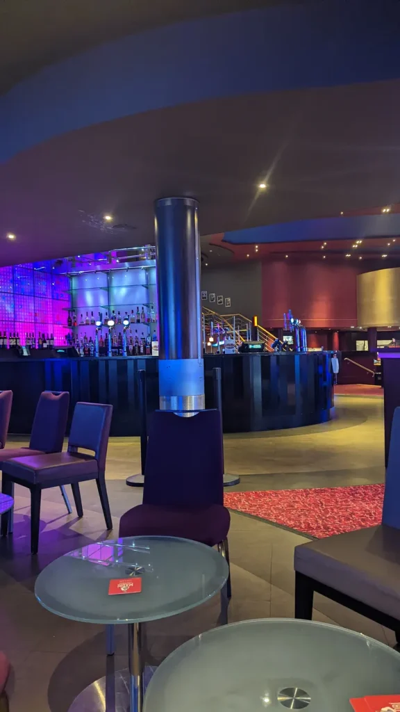 Bar lounge inside Grosvenor Casino Newcastle with purple lighting
