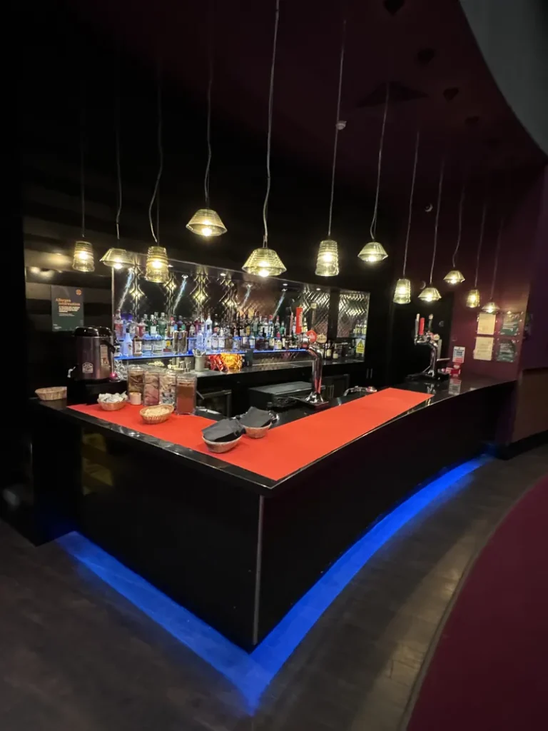 Bar counter with hanging lights inside Grosvenor Casino Reading South