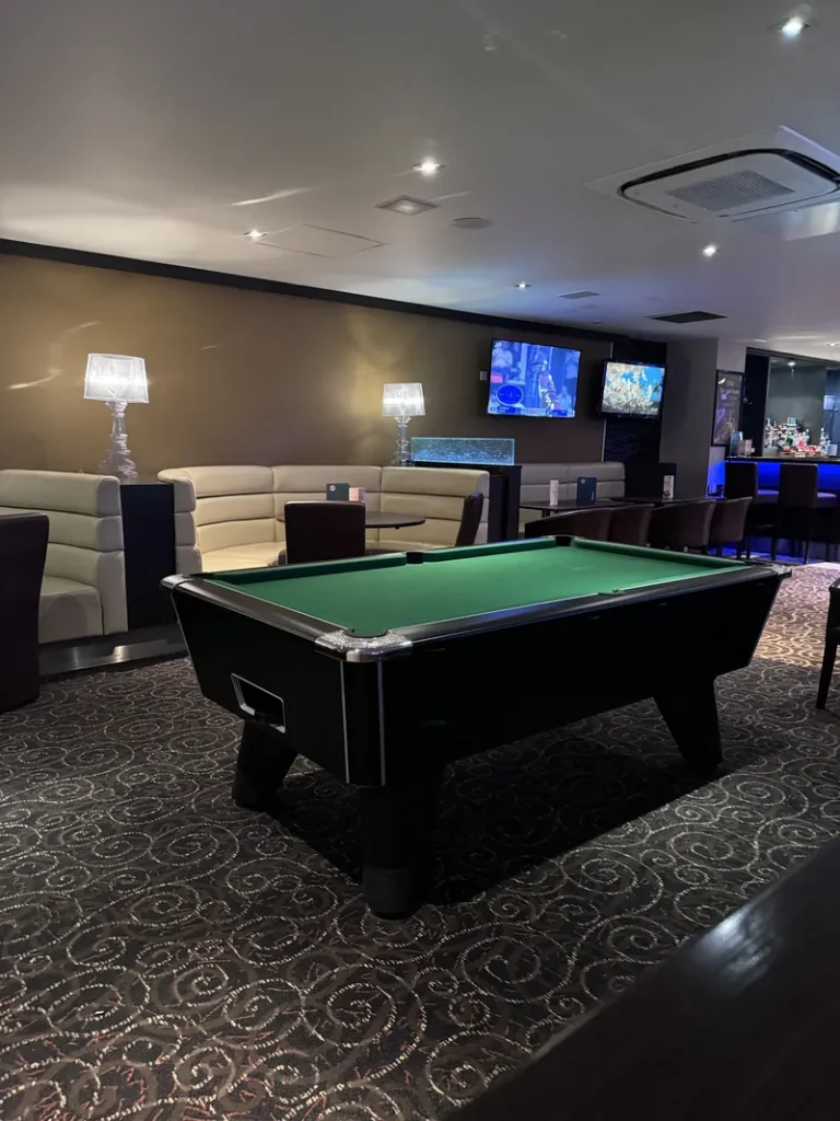 Lounge area with pool table and seating at Grosvenor Casino Stockport