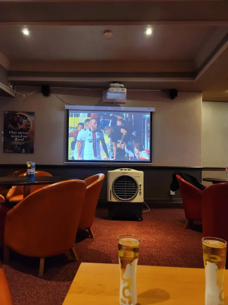 Sports lounge with projector screen at Grosvenor Casino Swansea