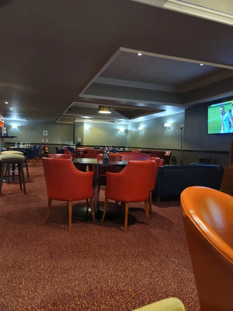 Lounge area with TV screen at Grosvenor Casino Swansea
