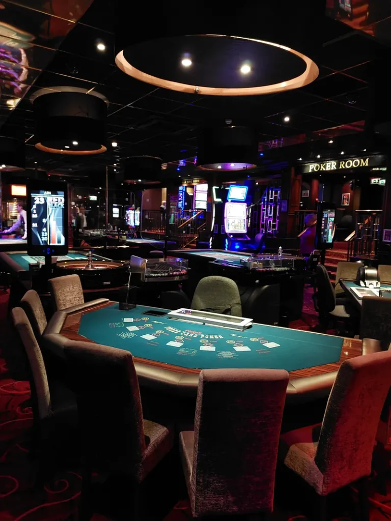 Poker table inside Napoleons Casino Sheffield near the poker room sign