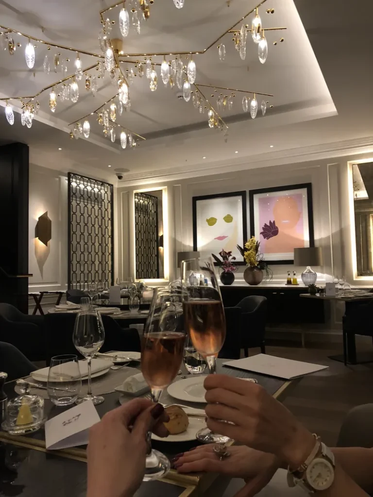 Elegant restaurant interior with champagne glasses at Wynn Mayfair
